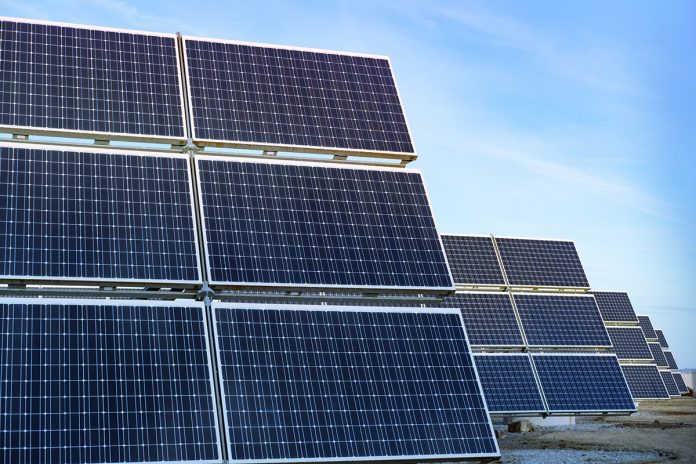 Rows photovoltaic panels stretch across solar farm, capturing su